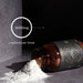 A brown glass jar labeled True Creatine+ lies on its side, spilling white powder onto a gray surface. Text reads 4500mg creatine per dose with a line pointing to the powder, highlighting muscle health benefits.