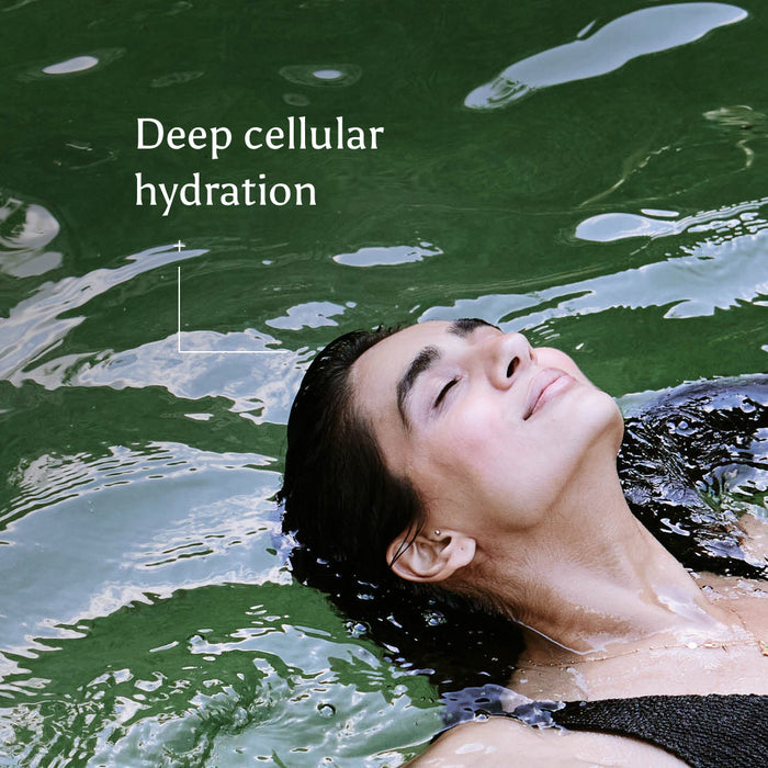 Woman floating in water with text: 'Deep cellular hydration'