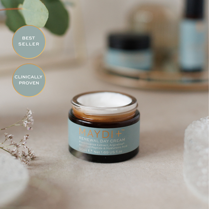 Maydi+ Renewal Day Cream jar on a neutral background with decorative elements best seller and clinically proven.