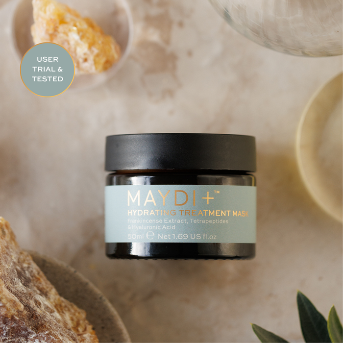 Maydl+ hydrating treatment mask jar on a natural stone background