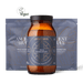 An amber glass bottle of Ancient + Brave's True Hydration electrolyte formula centered in front of two blue pouches, with a small Vegan logo above on a black background.